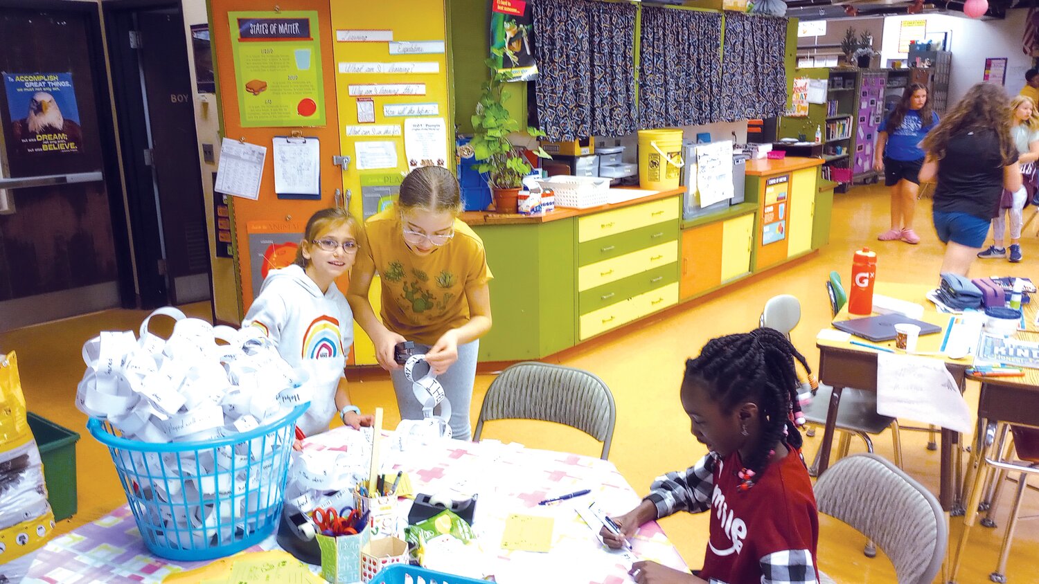 TEAMWORK: The room is abuzz with pride and effort as students work together to make their dream of bringing kindness to the school into a reality. (Herald photo by Ed Kdonian)